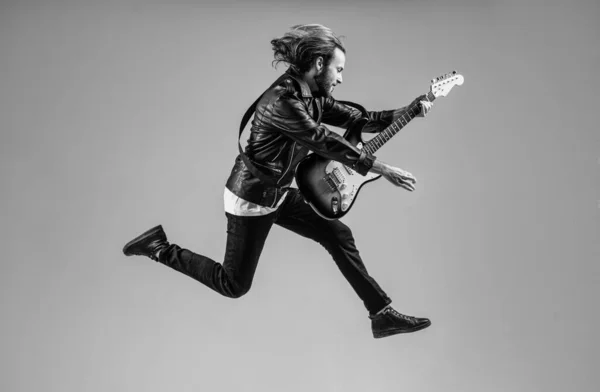 Emotional Bearded Rock Musician Playing Electric Guitar Leather Jacket Jumping — Stock Photo, Image