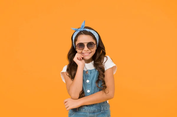 Little fashionable girl summer outfit with sunglasses, fashion trend concept.
