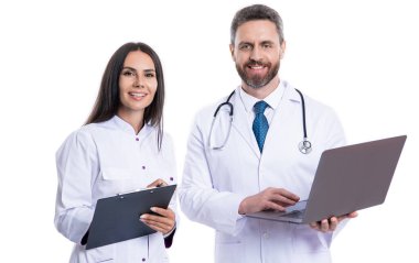 happy doctor with internist noting ehealth. doctor and internist wear white coat and noting ehealth. internist and doctor with laptop and anamnesis. doctor and internist do ehealth noting clipart