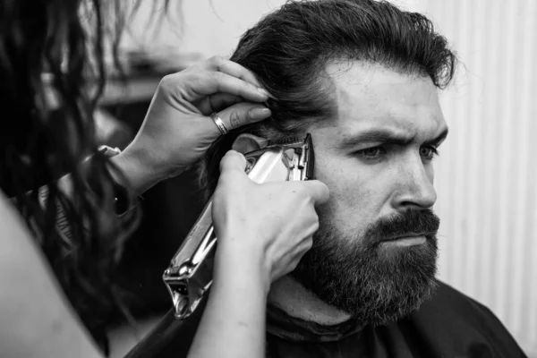hair cut and beard care for caucasian guy in barbershop, haircare.