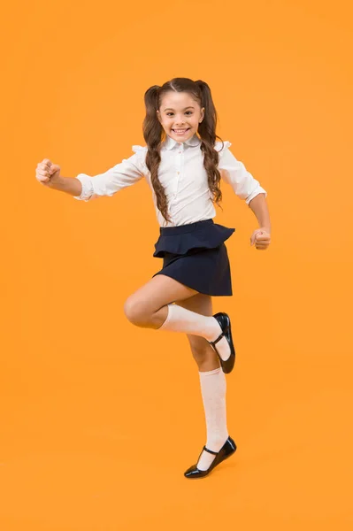 Keep going. Active kid. Girl on way knowledge. Knowledge day. Back to school. Kid cheerful schoolgirl running. Pupil want study. Active child in motion. Freedom concept. Knowledge determined success.