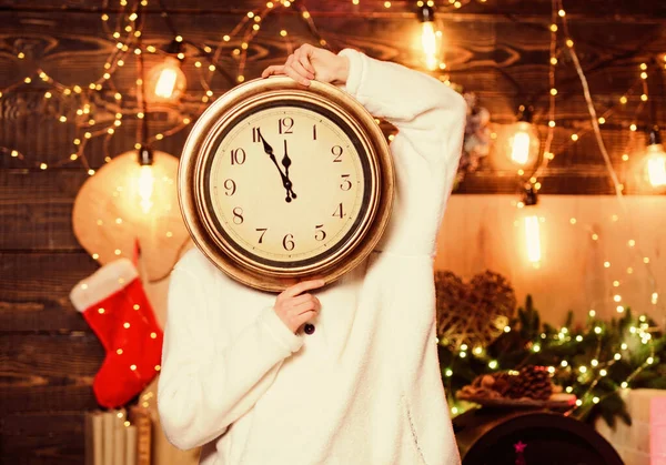 Merry christmas. Time for miracles. Few minutes left. Time for winter party. Woman Santa hat hold vintage clock. Time to celebrate. New year countdown. Unexpectedly soon. Midnight concept. Make wish.