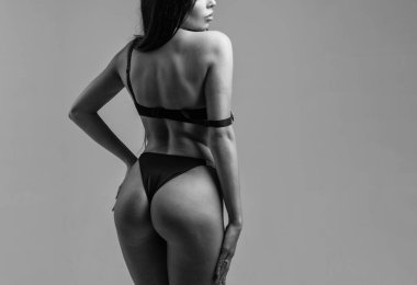 sexy woman with perfect body ass and skin in erotic lingerie, copy space, body.