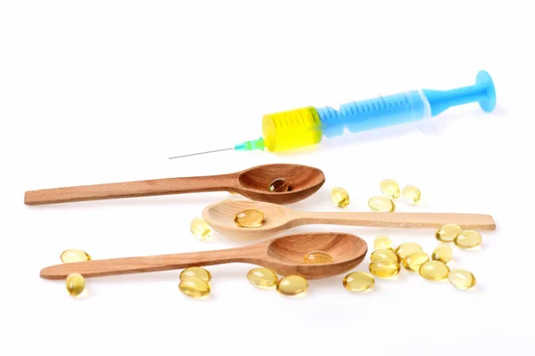 Syringe Capsules Wooden Spoons Isolated White Background Omega Pills Spoons — Stock Photo, Image