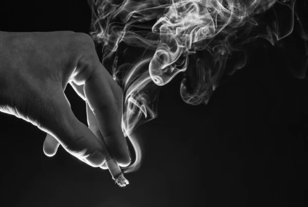 Male Hand Hold Cigarette Butt Smoke Swirls Dark Background Nicotine — Foto de Stock