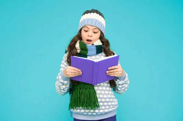 stock image study well. smart kid study. back to school. winter story reading. little book lover. cosy and comfort concept. my favorite story. leisure in winter time. childhood development. Girl reading book.