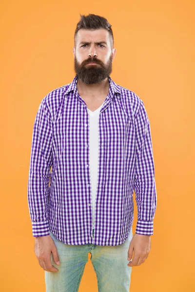 Mature upset man. Male fashion and spring style. Brutal bearded hipster in checkered shirt. Summer hipster. sad man with beard on yellow background. brutal man feel upset. sad and hopeless guy.