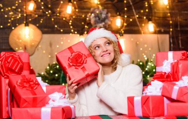 December happy moments. Happy woman and bunch of gifts boxes. Girl ready for celebration. Gifts integral part of new year celebration. Intrigued concept. Festive mood. Beautiful wrapped gifts. clipart