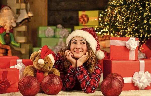 Happy girl at christmas tree. Woman enjoy festive mood. Making wish. Dreaming about future year. Happy new year. Christmas tradition. Winter decorations. Celebrate holiday. Christmas preparations.