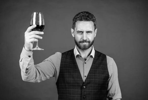 sommelier. businessman drink red wine. cheers for valentines day. alcohol drinking. handsome male on romantic date. bearded bartender winetasting. unshaven man with wine glass. professional barman.