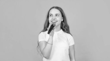 karaoke music. wireless audio accessory. childhood development. child singer sing in microphone. vocal education in musical school. happy teen girl singing in mic.