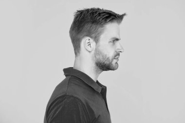 profile of guy with bristle on yellow background, skincare.