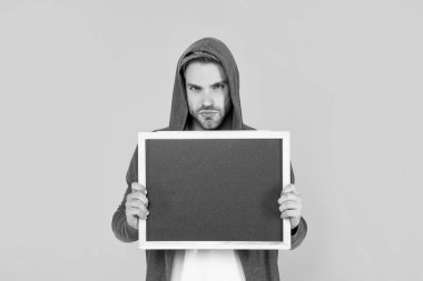 place for useful information. advertisement copy space. your marketing design. man hold blackboard. guy make announcement. male behind chalkboard.