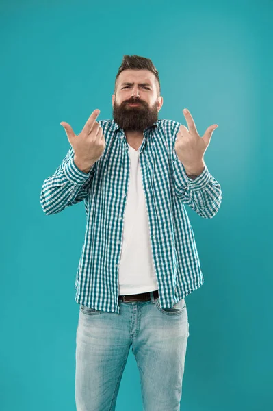 Listen to me. Bearded man gesticulate blue background. Brutal hipster in casual wear. Casual style. Casual fashion trends. Fashion and style. Casual and trendy.