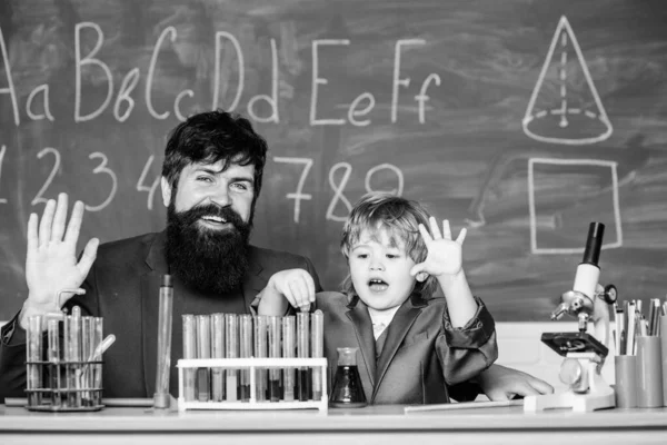 Chemistry and physics biology. father and son at school. biotechnoloy research concept. Back to school. Explaining biology to child. bearded man teacher with little boy. let creativity soar.