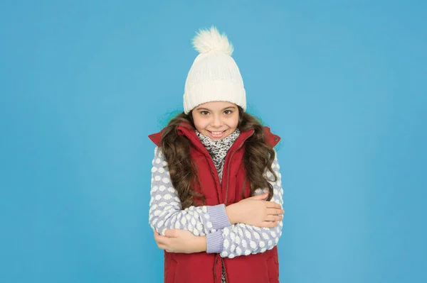 It is so cold. childhood happiness. thermal clothing. happy teen girl wear warm clothes. winter kid fashion. child with long curly hair in knitted hat. cold season style christmas activity.