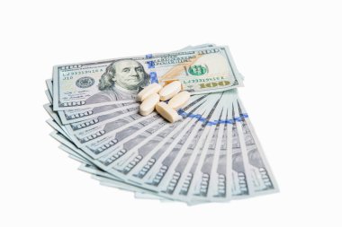 photo of expensive medicine cost. expensive medicine concept. money for expensive medicine isolated on white background. vitamins of expensive medicine in studio.