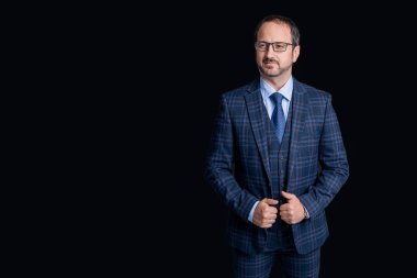 mature boss isolated on black background with copy space. boss in studio. boss wear jacket and tie. photo of boss in suit.