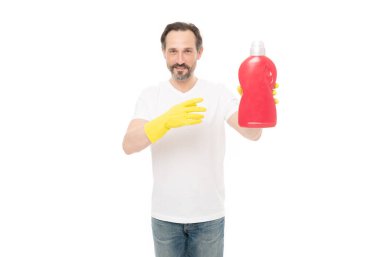 man with laundry detergent isolated on white, advertisement. man with laundry detergent in studio. man with laundry detergent on background. photo of man with laundry detergent bottle.