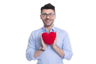happy man with love valentine heart in studio. man with love valentine heart on background. photo of man with love valentine heart box. man with love valentine heart isolated on white.