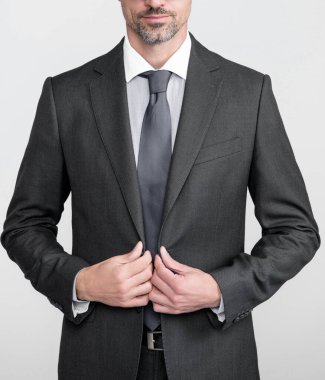 confident mature leader in formal business suit and spectacles.