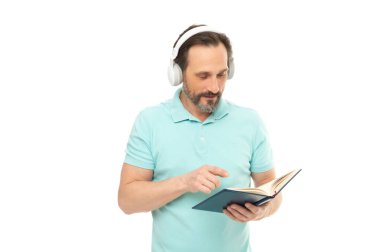 busy man reading elearning in headphones isolated on white. man reading elearning in headphones in studio. man reading elearning in headphones on background. photo of man reading elearning