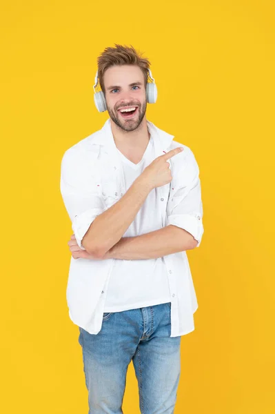 image of man wear music headphones. man wear music headphones isolated on white. man wear music headphones in studio. man wear music headphones on background.