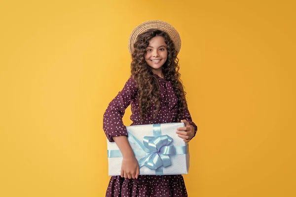 Smiling Child Curly Hair Hold Present Box Yellow Background — Stock Fotó
