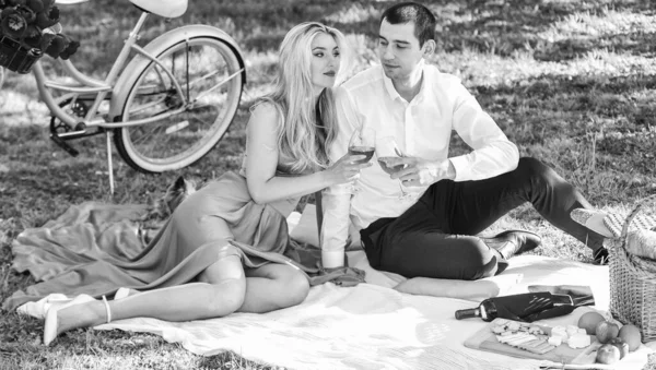 Love you tender. valentines day picnic. romantic picnic in park. cute couple on date on blanket. retro bicycle. happy couple in love. woman and man lying in park and enjoying day together.