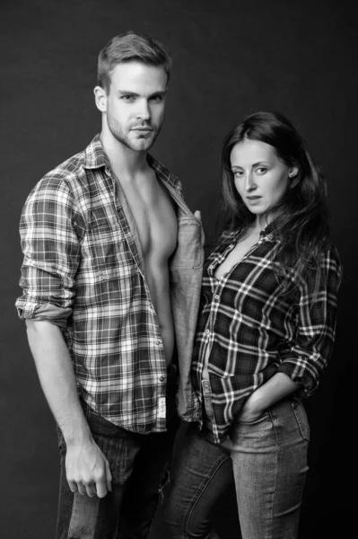 young sexy man and woman together in checkered shirt, fashion.
