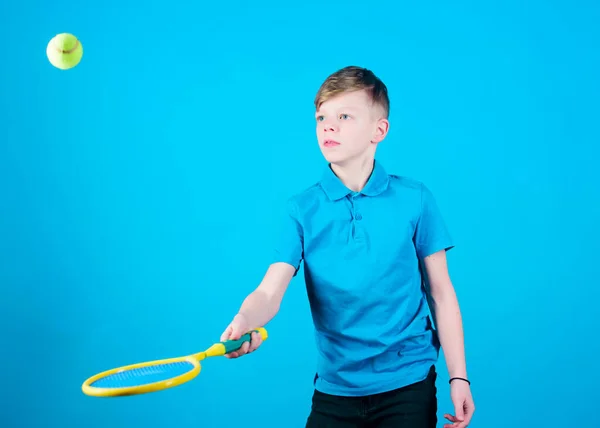 Tennis is fun. Gym workout of teen boy. Little boy. Fitness diet brings health and energy. Tennis player with racket and ball. Childhood activity. Sport game success. Happy child play tennis.