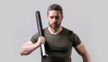 mature hooligan man with bat in studio. photo of hooligan man with bat. hooligan man threatening with bat. hooligan man with bat isolated on grey background
