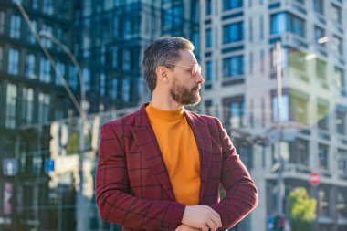 handsome stylish guy in jacket outdoor. stylish guy in the street. stylish guy outside. photo of stylish guy wearing jacket.