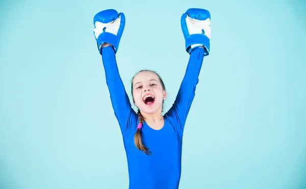 Full of energy. punching knockout. Childhood activity. Fitness diet. energy health. Sport success. sportswear fashion. Happy child sportsman in boxing gloves. workout of small girl boxer.