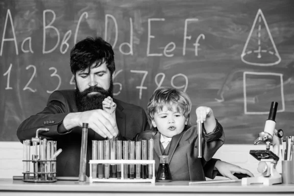 Teacher bearded scientist man child test tubes. Chemical experiment. Special and unique. Genius child private lesson. Knowledge day. Genius minds. Genius kid. Joys and challenges raising gifted child.