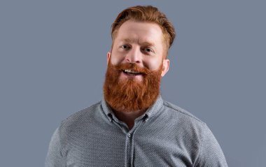 studio shot of happy bearded man. beard care. handsome bearded man has beard. bearded man with long beard isolated on grey background.