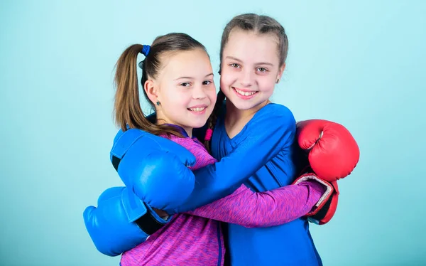 Happy children sportsman in boxing gloves. Sport success. Friendship. Fitness. energy health. workout of small girls boxer in sportswear. punching knockout. Childhood activity. I am ready to fight.