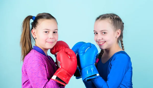 Fitness diet. energy health. Sport success. Friendship. workout of small girls boxer in sportswear. Happy children sportsman in boxing gloves. punching knockout. Childhood activity. Caucasian boxer.