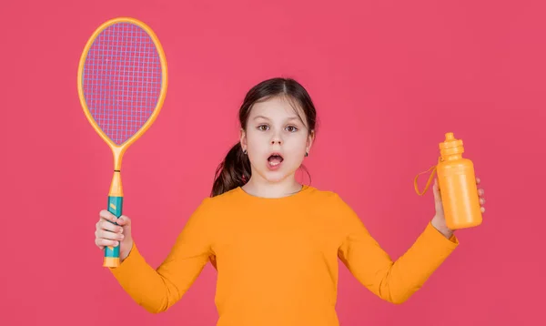 Amazed Kid Hold Tennis Racket Water Bottle Pink Background — Foto Stock