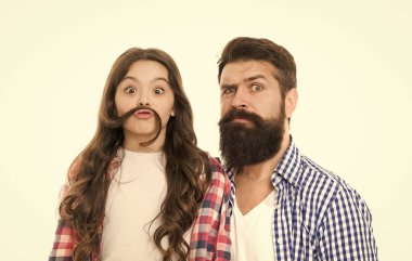 Moustache is under your nose. Father with moustache and beard hair and little daughter with long hair. Bearded man with beard and natural moustache and small girl making fake moustache with her hair.