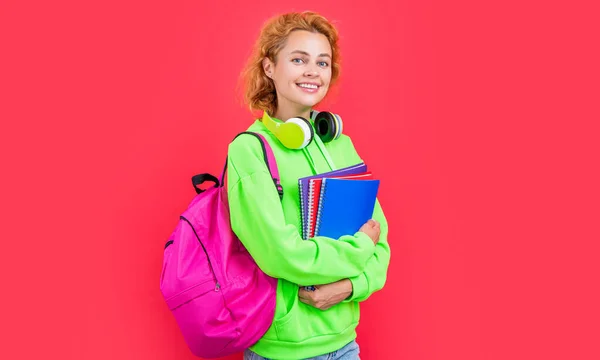 school education of cheerful woman student. school woman education isolated on red background. school woman education at studio. photo of school woman education hold backpack.