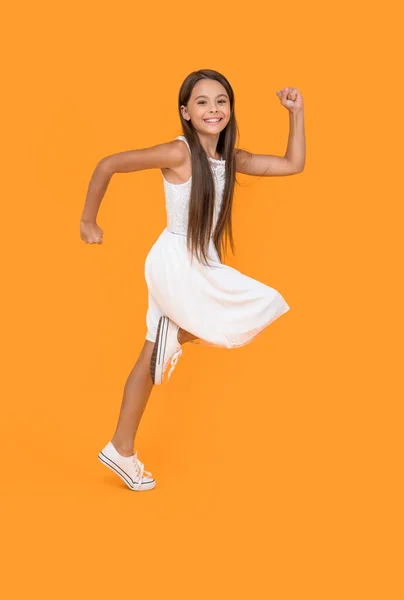 Happy Teen Girl White Dress Running Yellow Background — Stok Foto