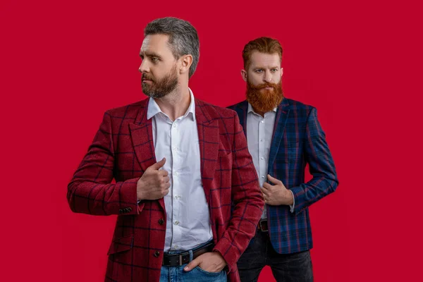 formal elegant men on background. image of formal elegant men in formalwear. formal elegant men isolated on red. formal elegant men at studio.