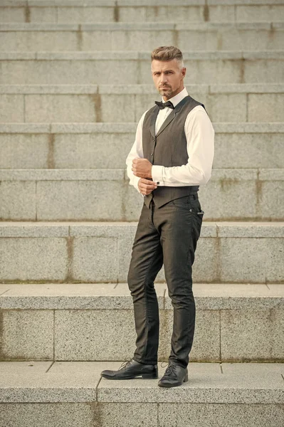 mature man in formalwear. formal fashion for man. elegant man wearing formal suit. full length.