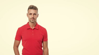 handsome man with graying hair in red shirt isolated on white background.