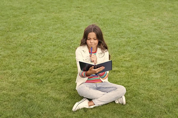 Thinking Teen Child Making Notes Notebook Sitting Grass Taking Notes — 图库照片