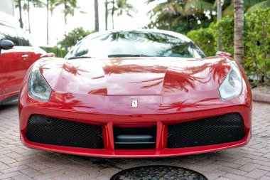 Miami Beach, Florida USA - April 18, 2021: red Ferrari 488 GTB, front view low angle.