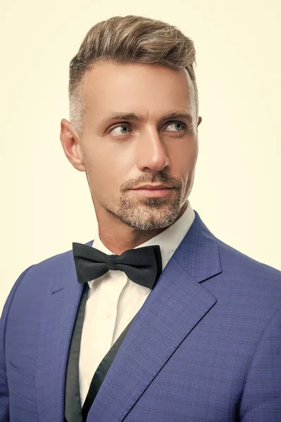 face of elegant man waiter with bow tie isolated on white background.