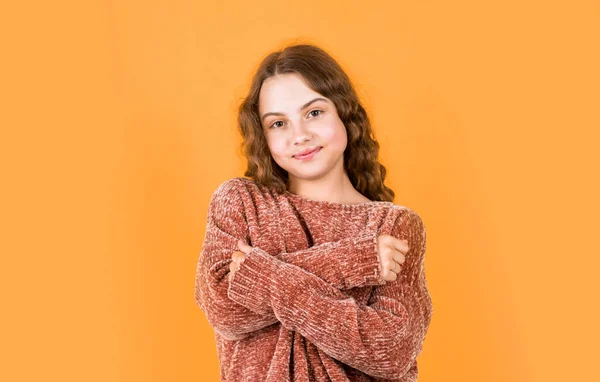 Hairdresser salon. Pretty girl curly hair yellow background. Adorable small child. Beautiful little model. Healthy curls. Easy hairdo. Beauty supplies. Perfectly untangle curly hair. Enjoy silky hair.