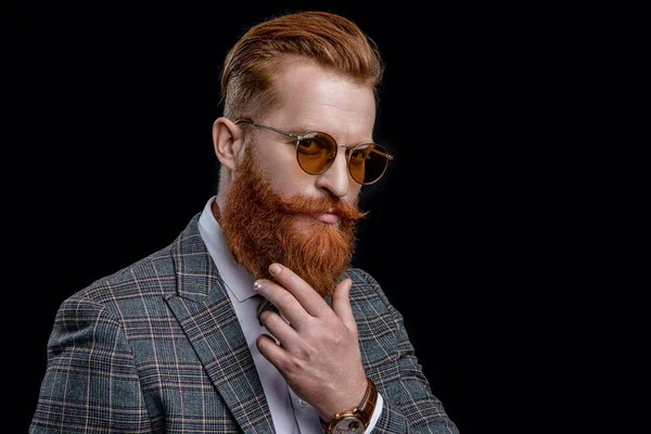 formal man in menswear and glasses isolated on black. formal man in menswear at studio. formal man in menswear on background. photo of formal man in menswear with beard.
